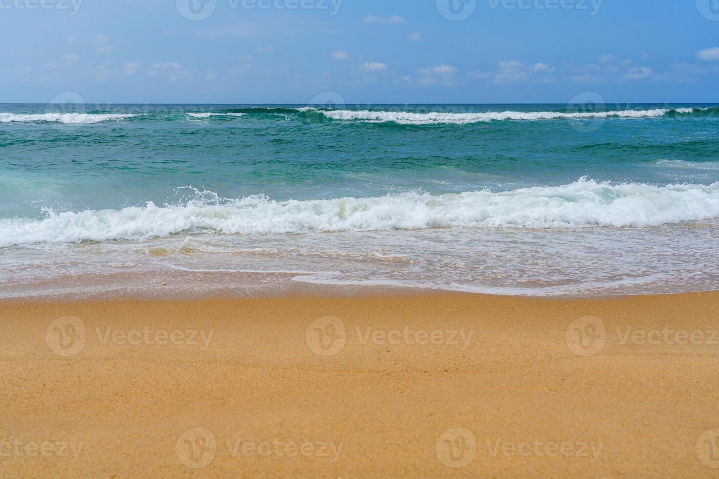 A beach with a surfboard on the sand photo