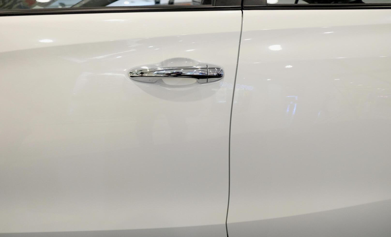 Handle of a silver car door photo