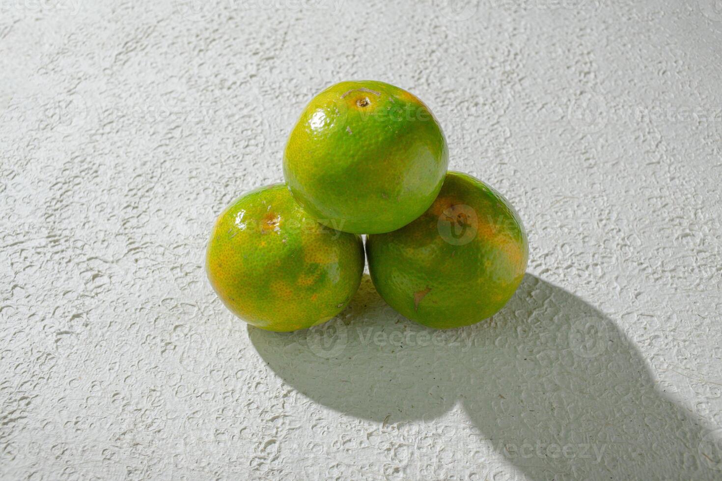 three green orange fruits photo