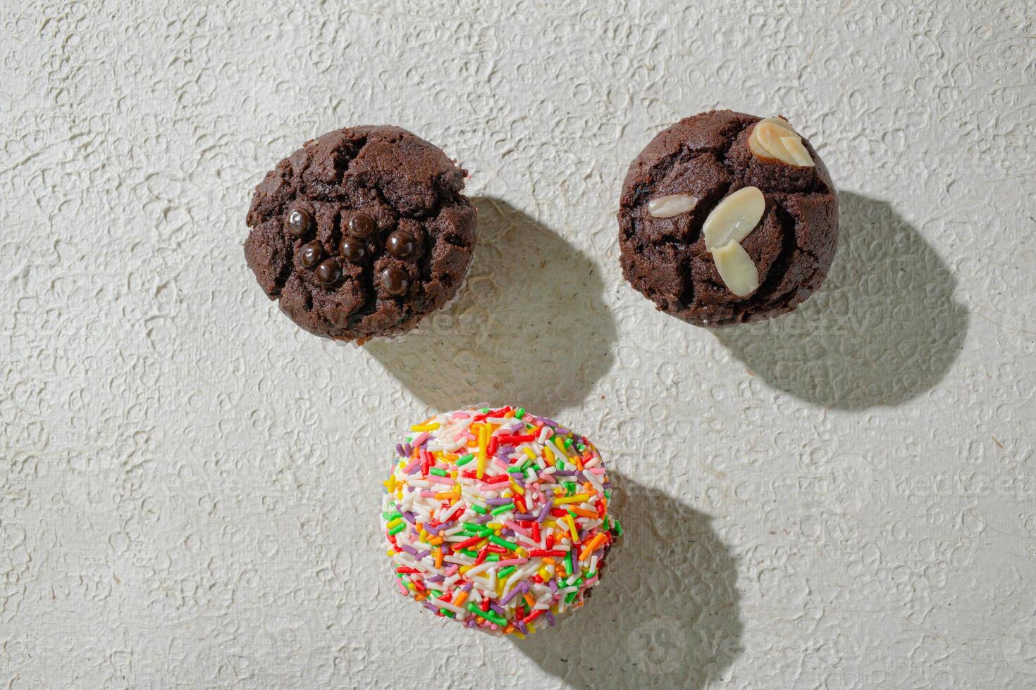 a close up of three different cookies on a table photo
