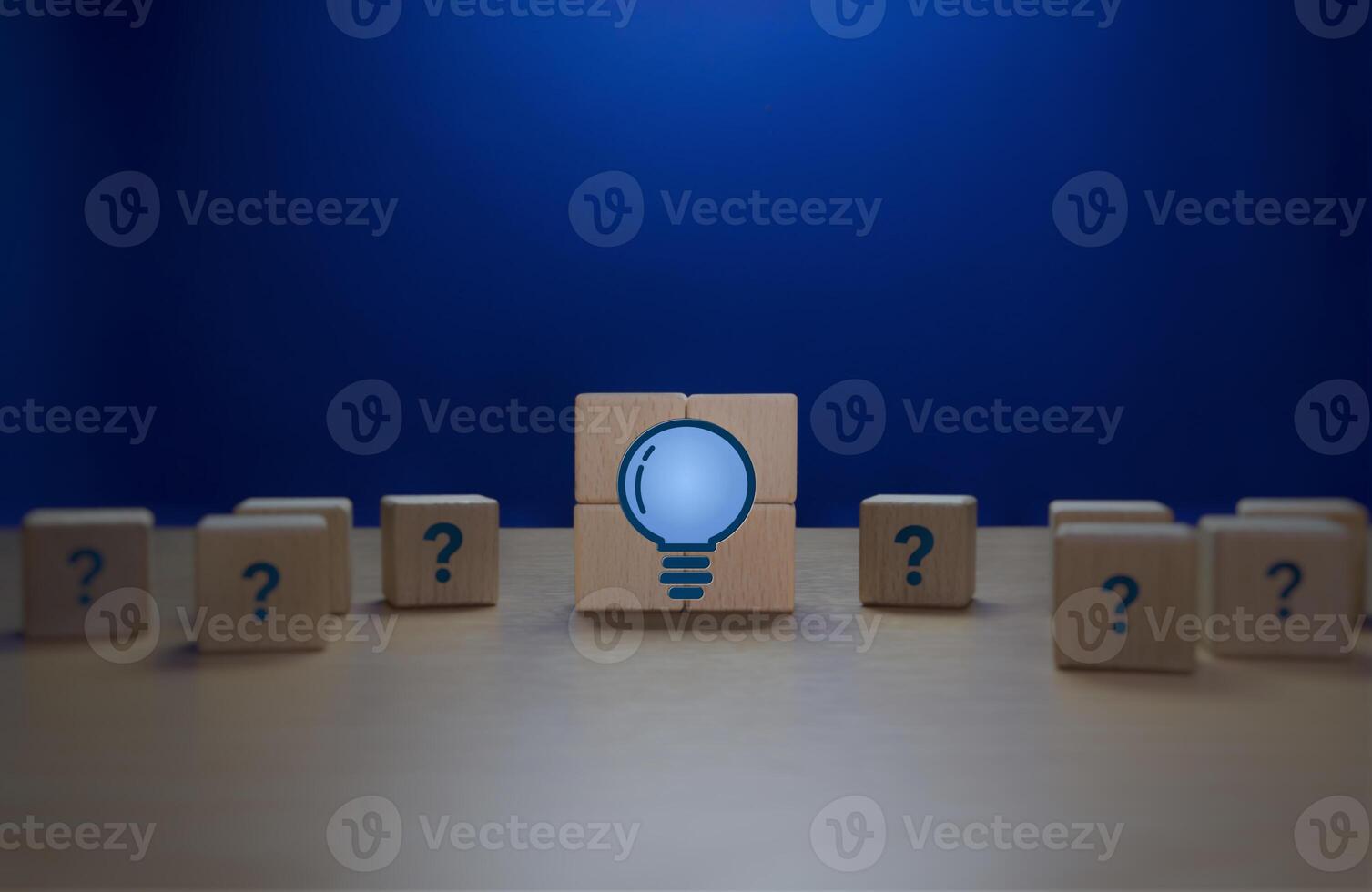Problem Solving, New Knowledge, Wisdom, Light Bulb Surrounded by Question Marks photo