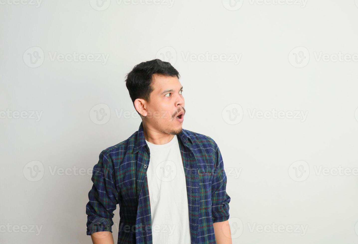 oh Wow, Omg. Portrait Of Surprised Asian Guy Opened Mouth In Amazement, Shocked Young Man Looking Stunned And Impressed, Emotionally Reacting To News photo
