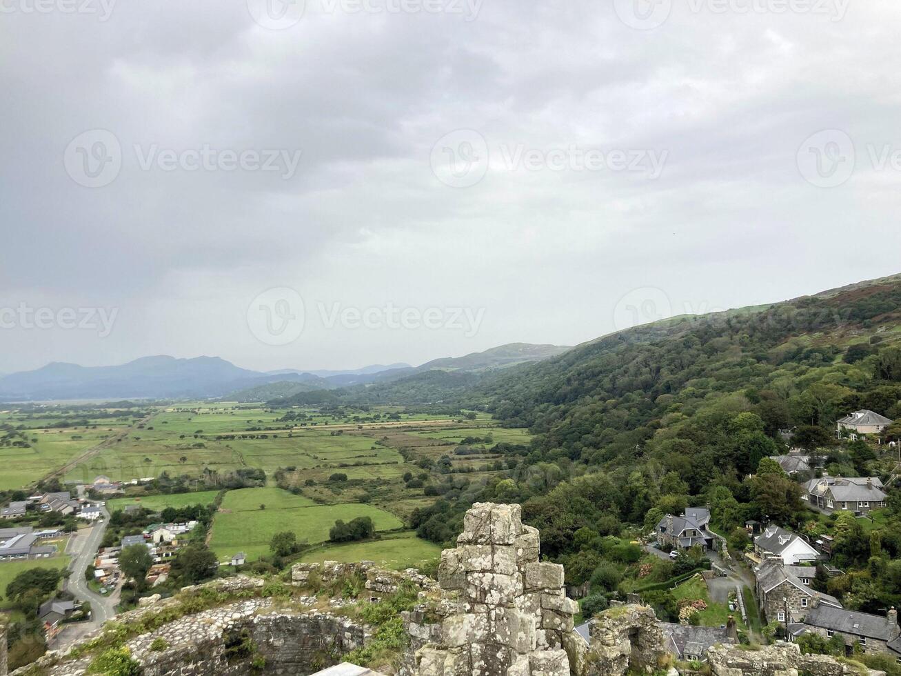 A view of a village and mountains from a castle photo