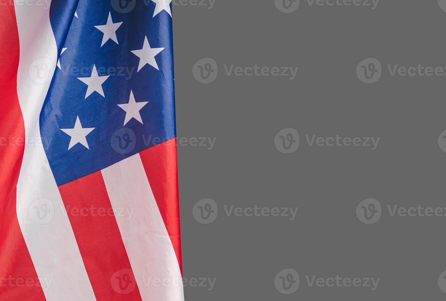 The American flag against a gray background with copy space for text photo