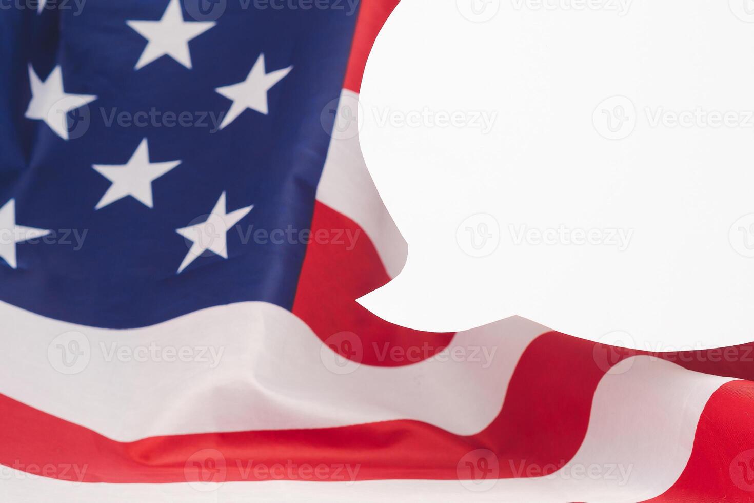 A blank white speech bubble on the American flag background photo