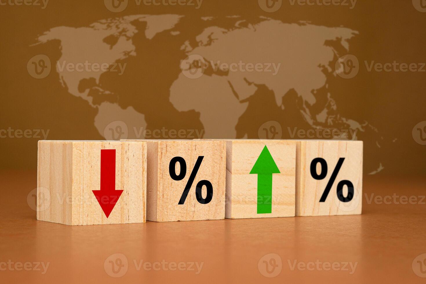 Interest rates concept. Wooden cubes with red arrows down, green arrows up, and percent symbols on a brown background photo