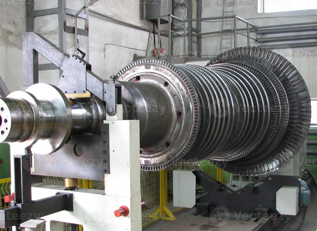 Industrial medium pressure turbine rotor on a balancing machine in a workshop. Mechanical engineering. Power engineering. photo