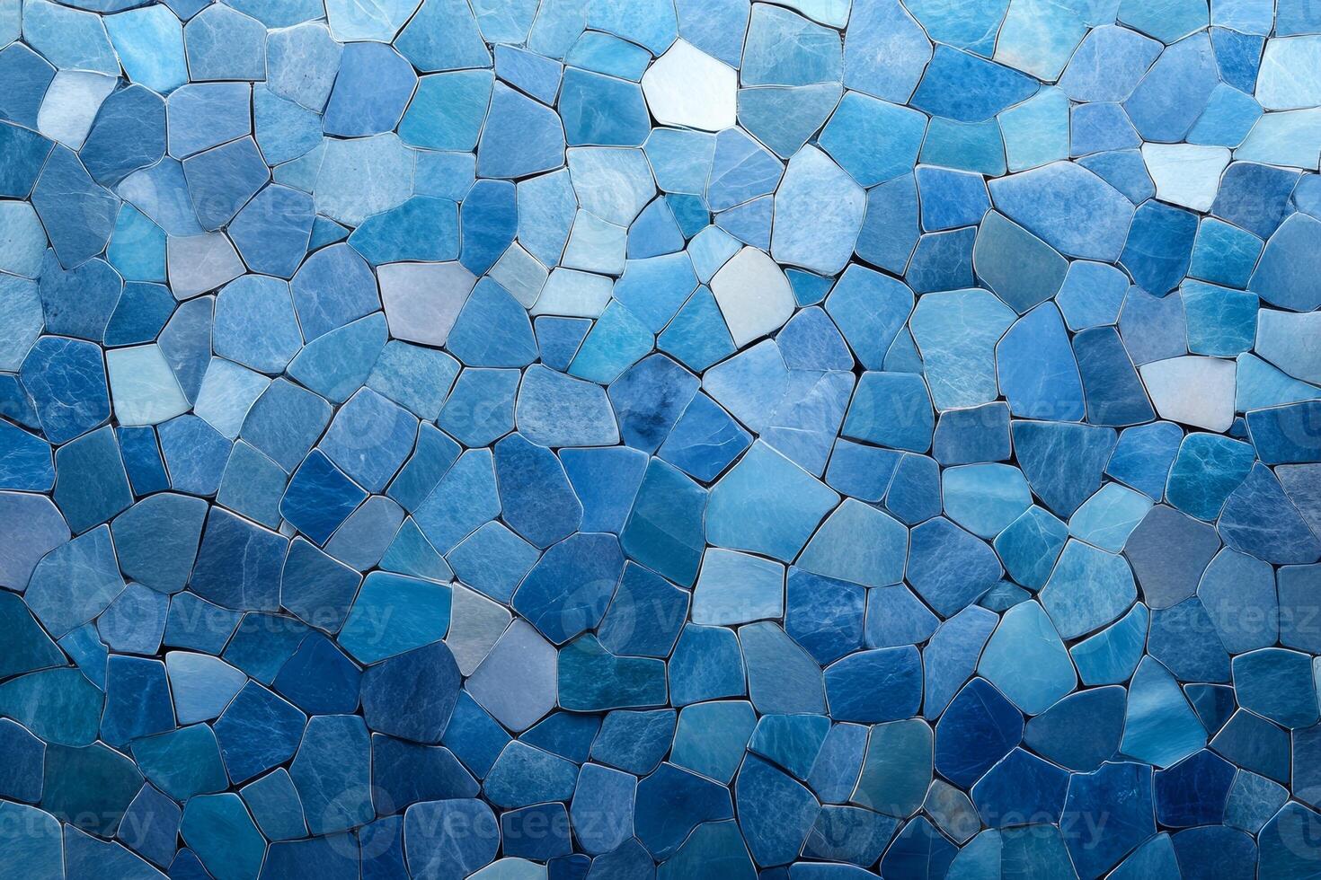 A mosaic of various shades of blue stones arranged in a decorative pattern. photo