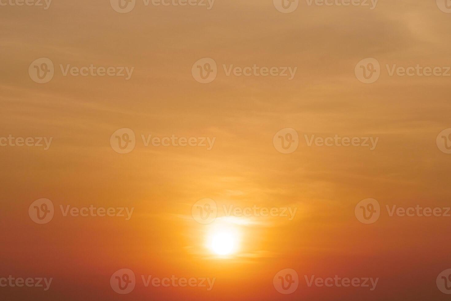 Stunning Golden Sunset Over Tranquil Horizon with Soft Clouds and Warm Light Creating a Serene and Peaceful Atmosphere photo