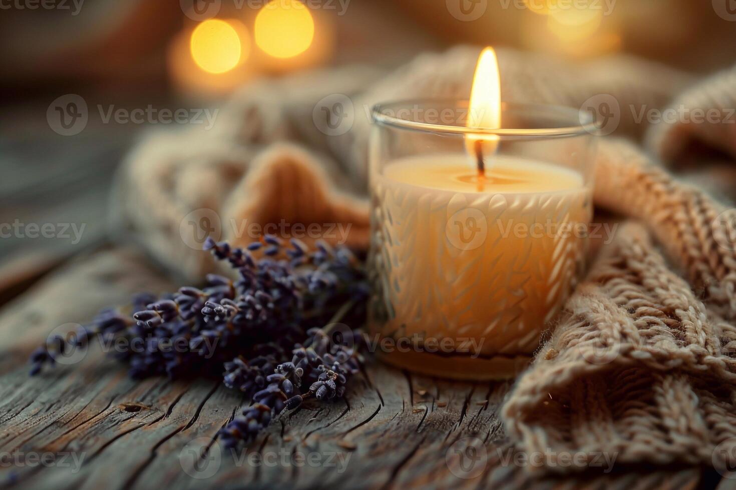 Warm Candlelight on Wooden Table with Melting Wax and Lavender photo