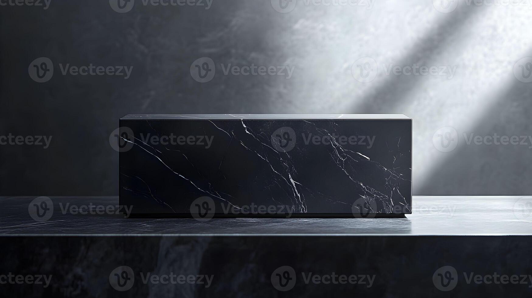 A black box sitting on a table in front of a wall photo