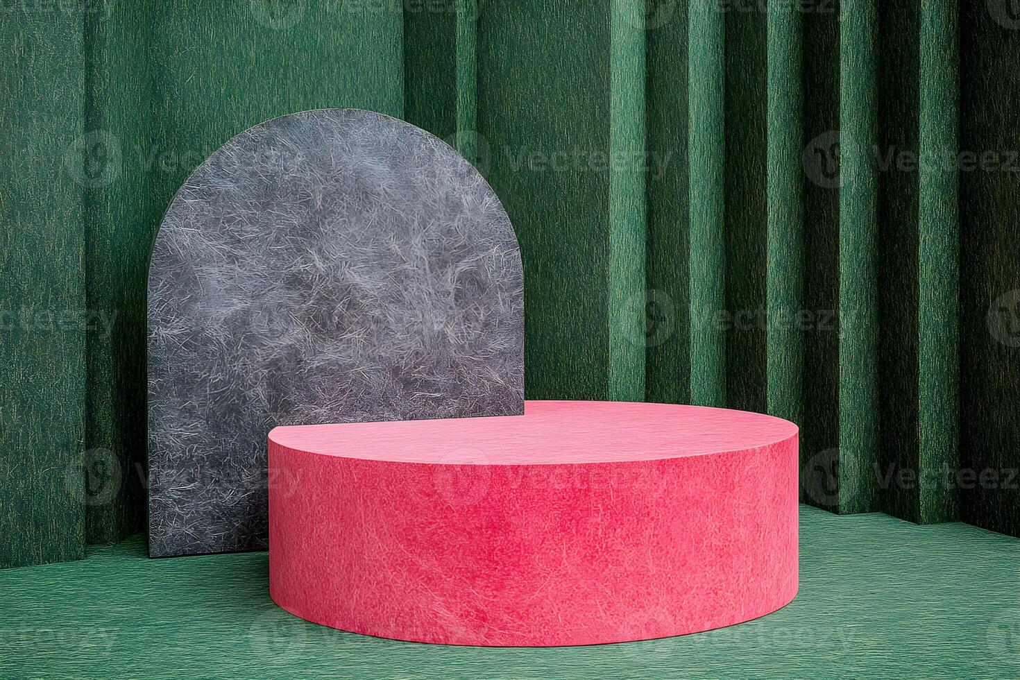 A pink and black round table in front of a green wall photo