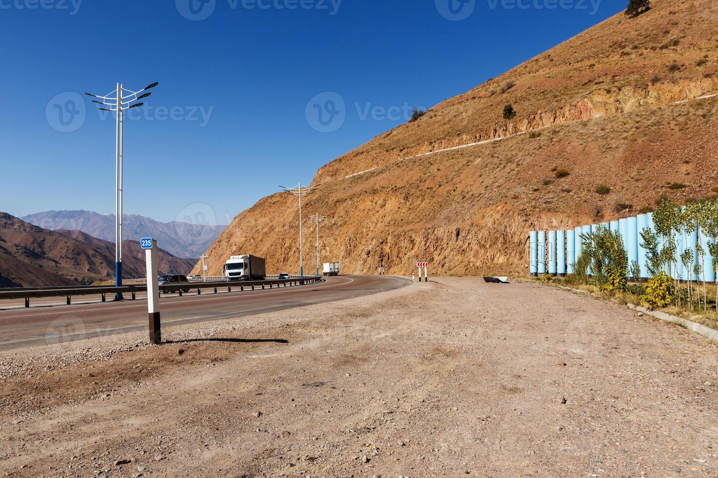 A 373 Tashkent Osh highway. Kamchik Pass in Uzbekistan. The road between automobile tunnels. photo