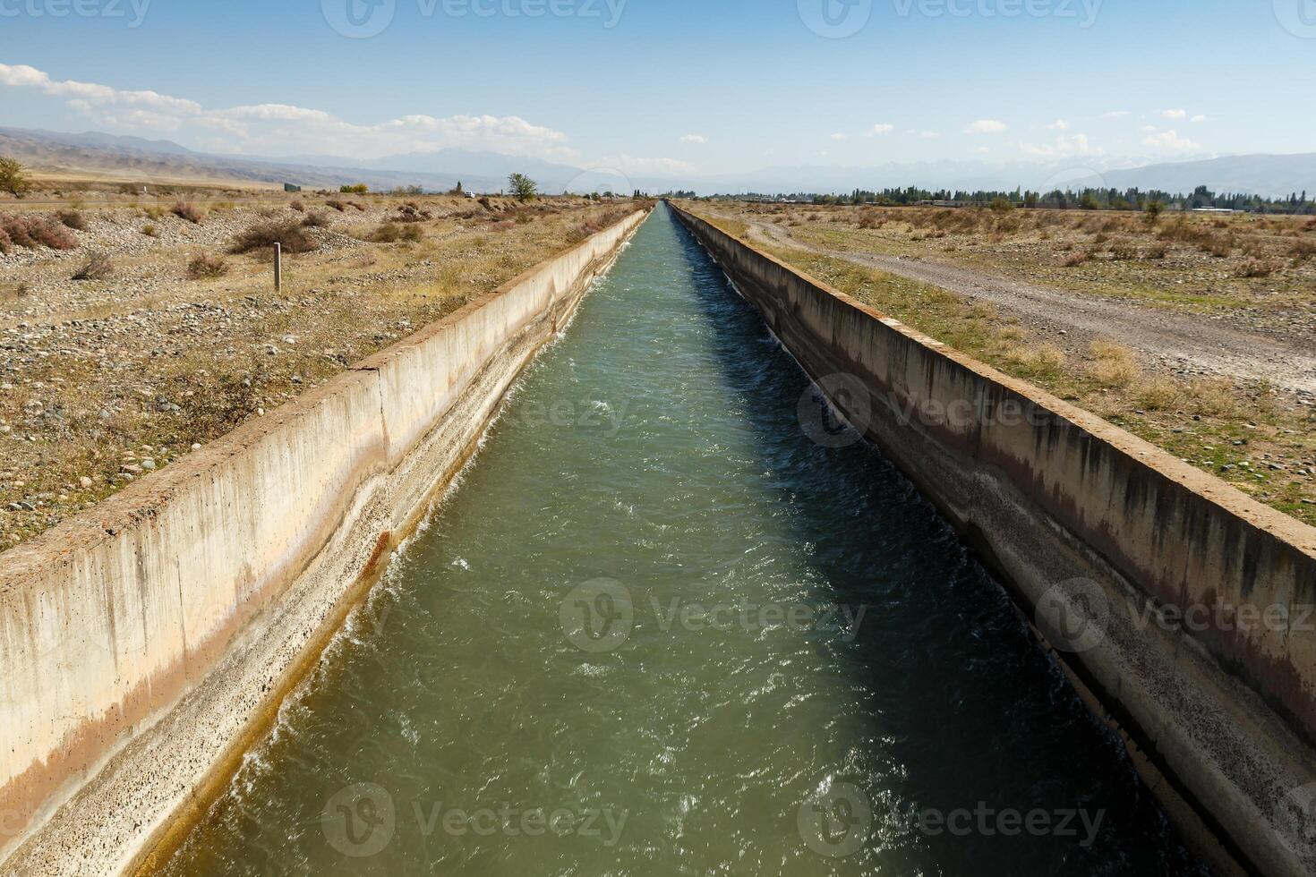 water flowing in an irrigation canal in Kyrgyzstan photo