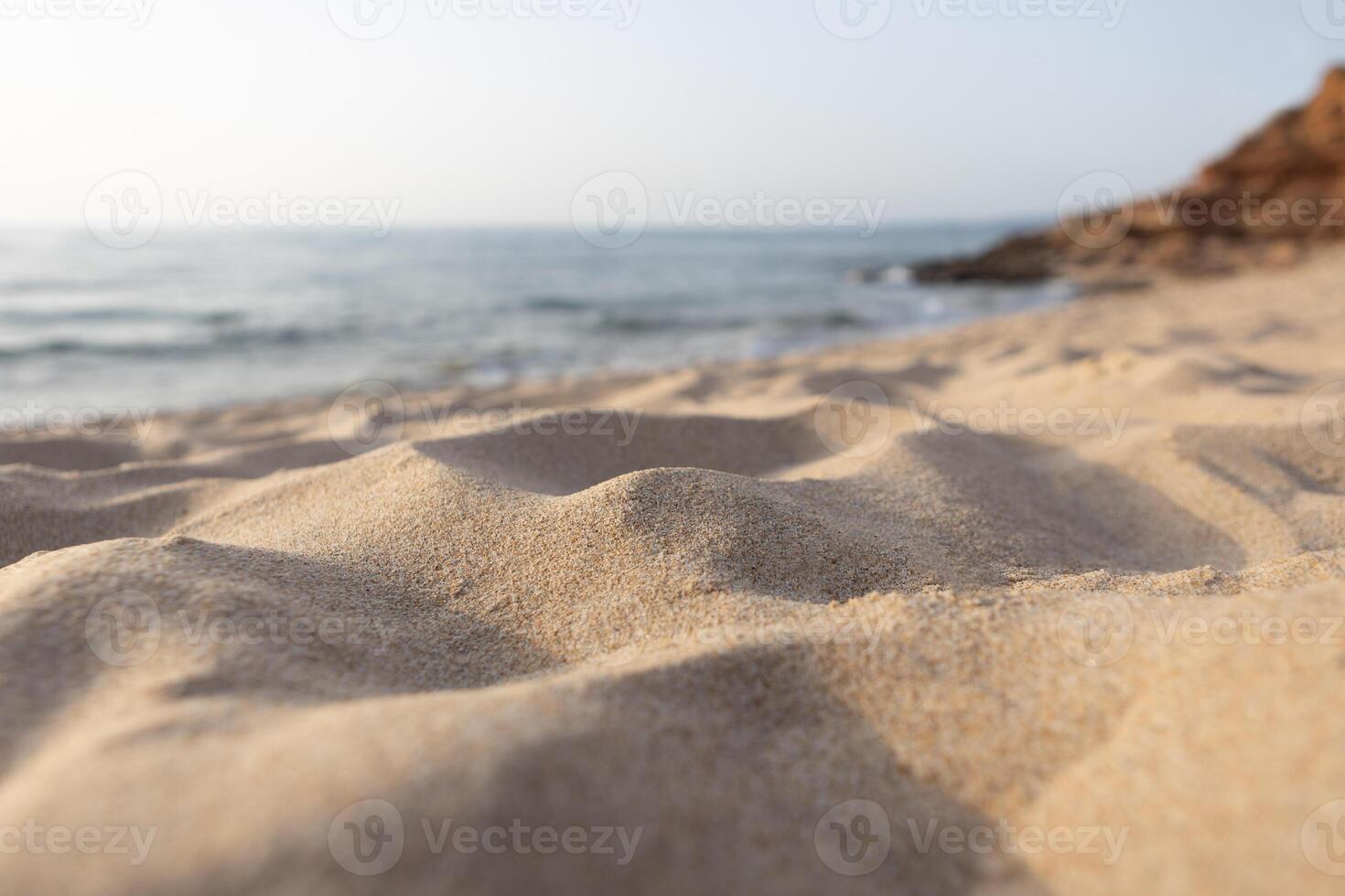 Low Angle View of Sand by the Sea photo