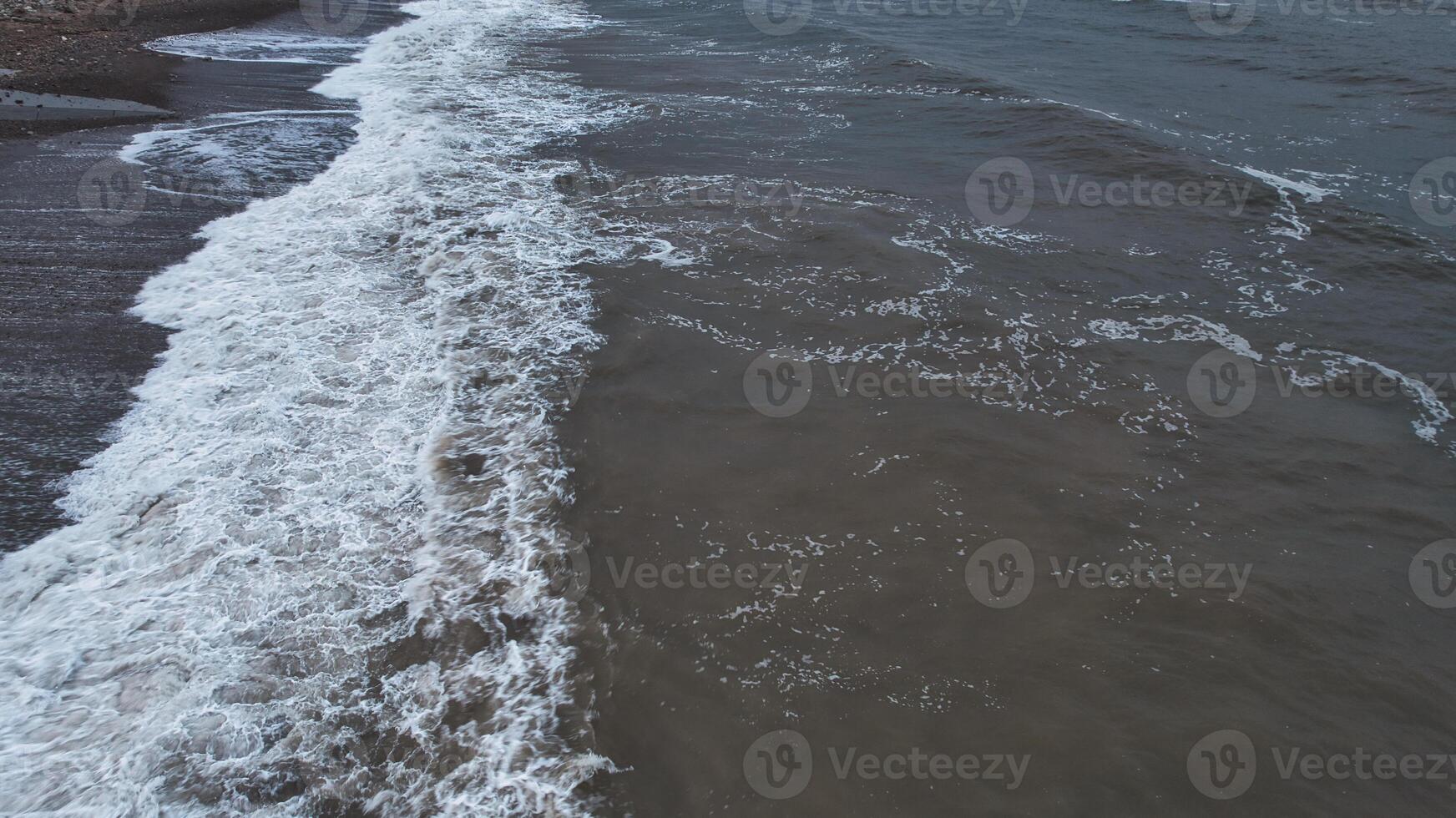 Aerial View of Ocean Waves and Shoreline photo