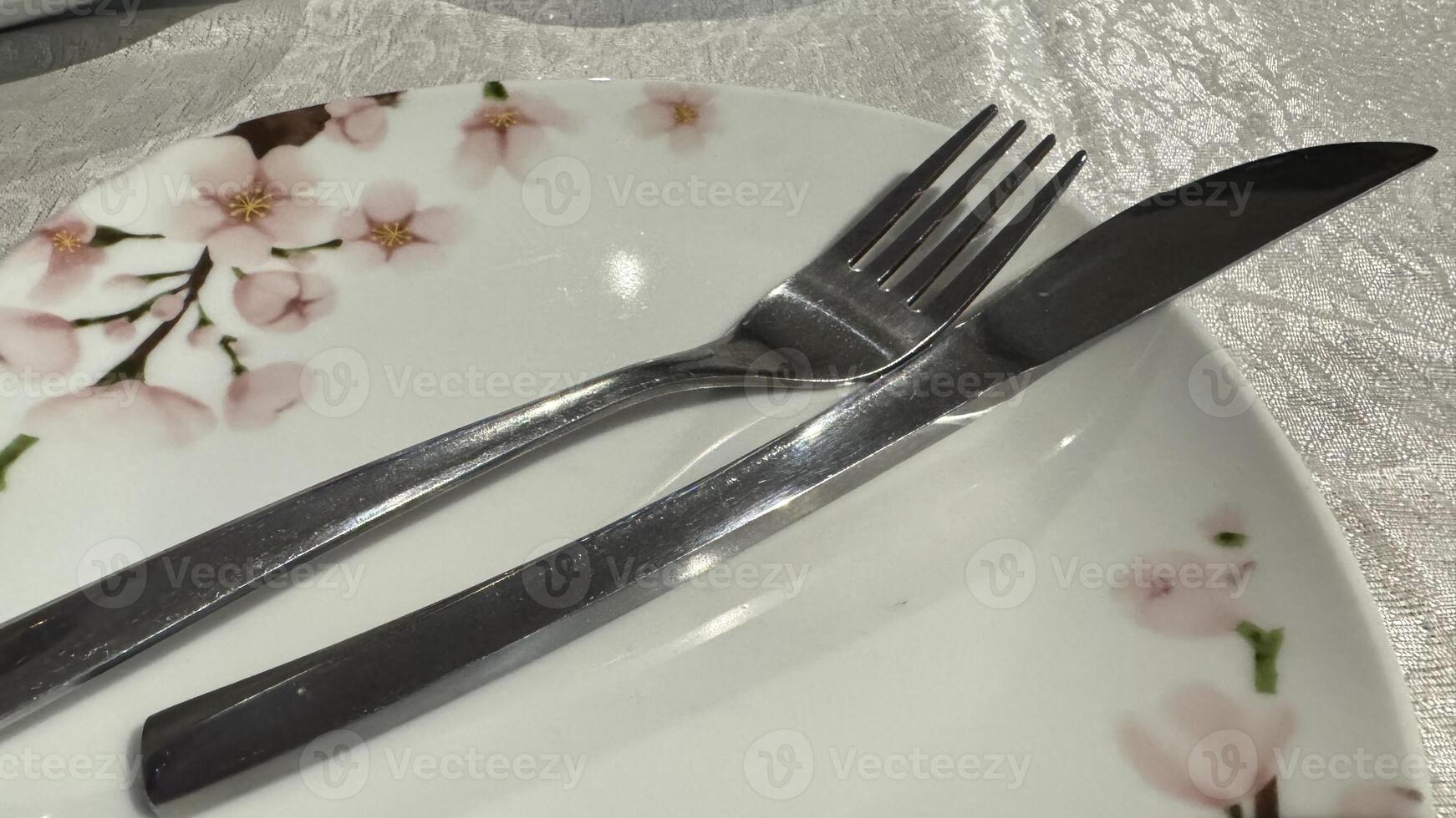 Plate with Cherry Blossom Design, Knife, and Fork photo