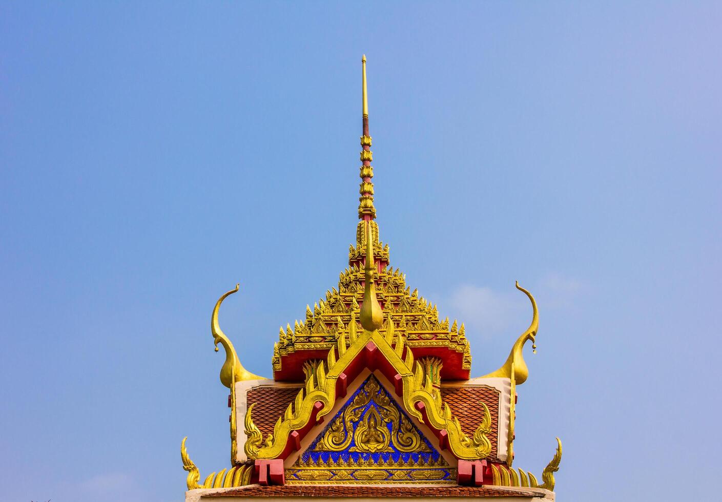 Roof top Thai art of Marble temple under blue sky photo