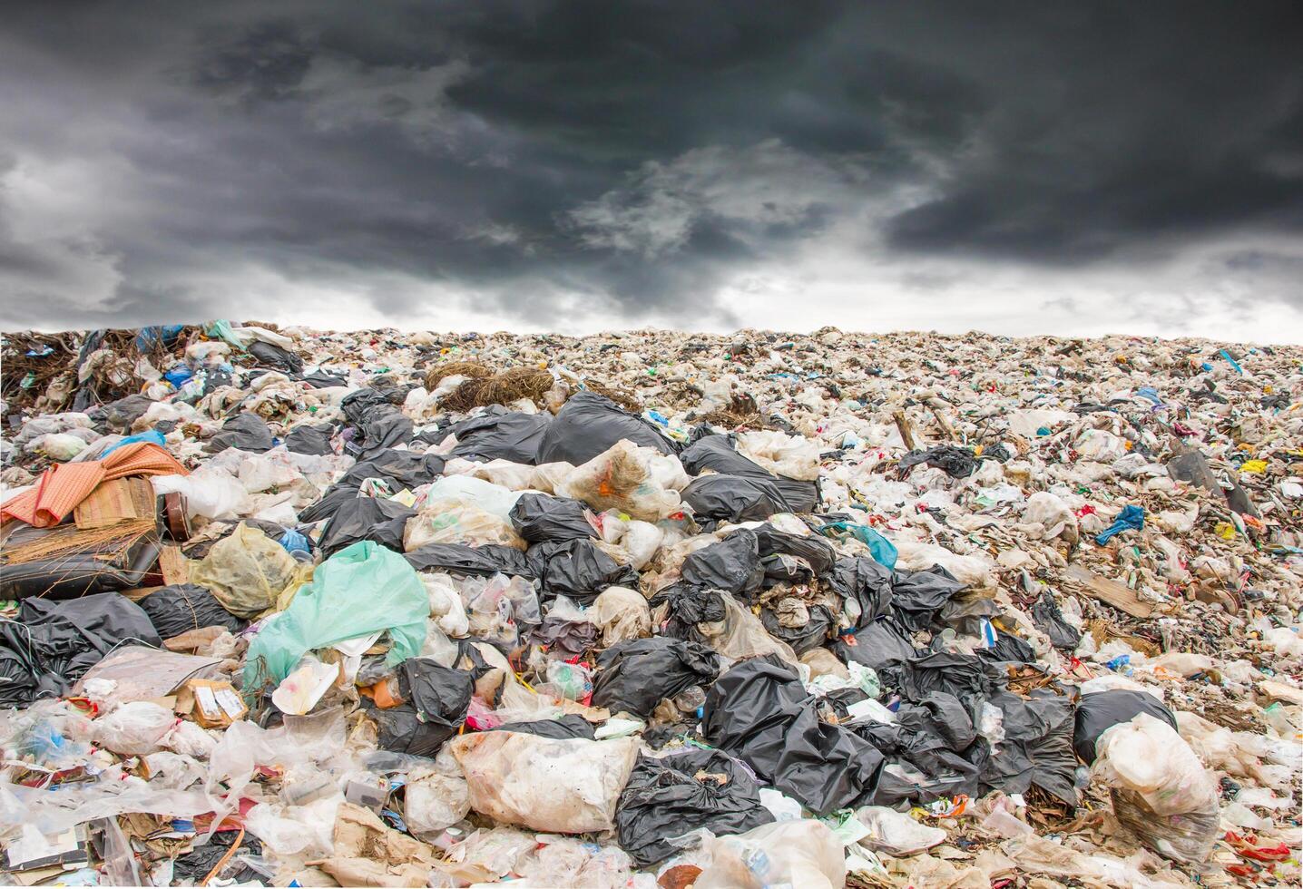 garbage dump pile in landfill photo
