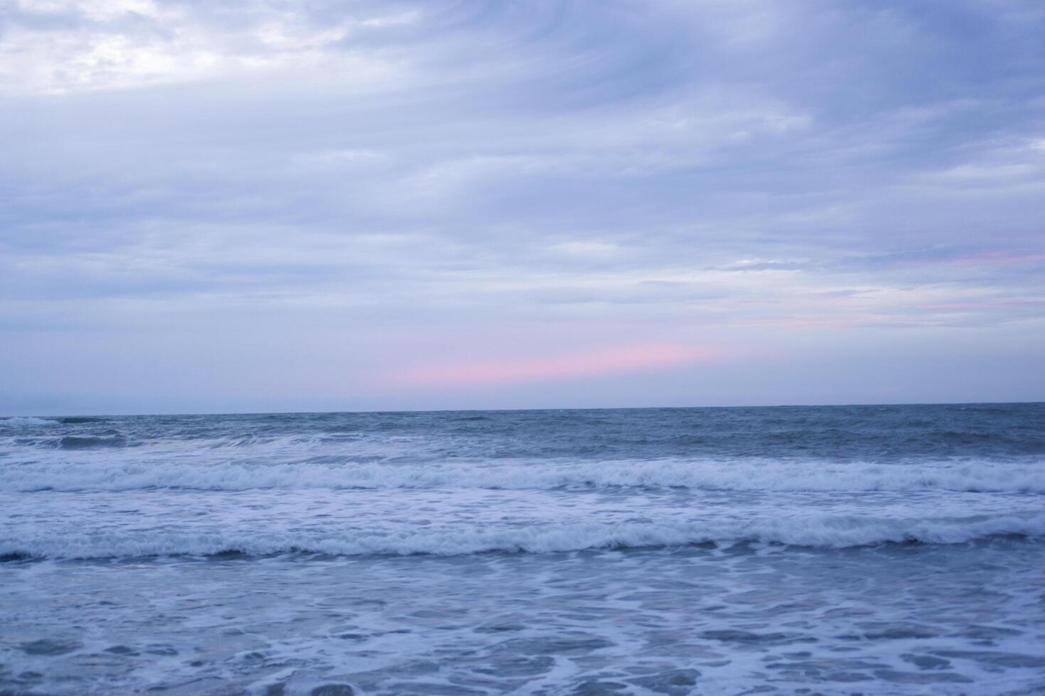 Calm Ocean with Blue and Pink Sky Gradations at Sunset photo
