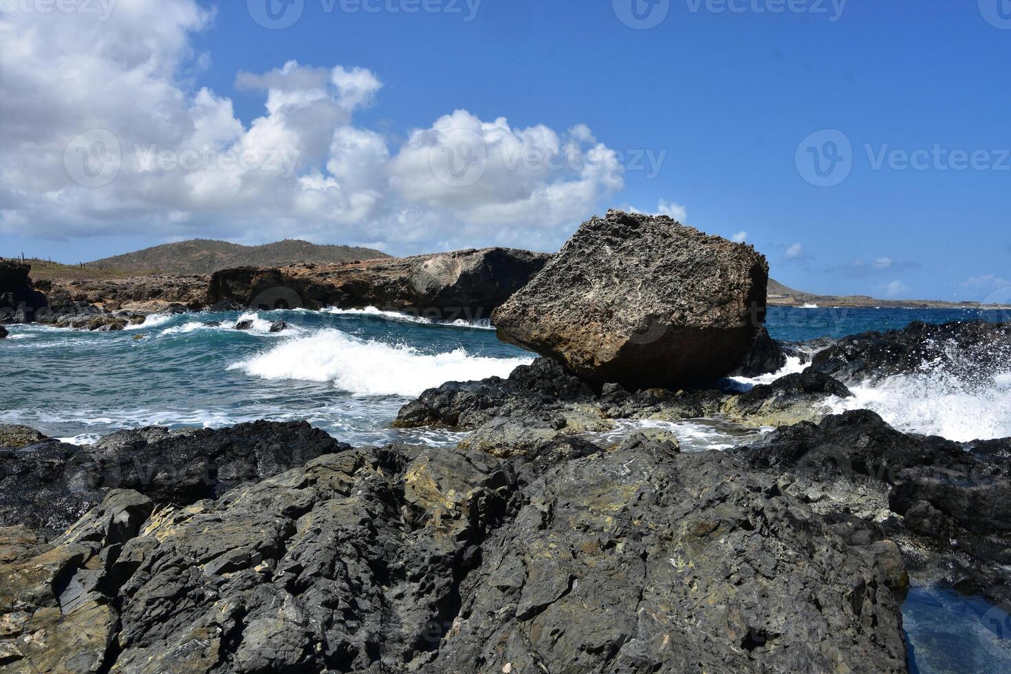 Large Waves at the Black Sand Beach in Aruba photo