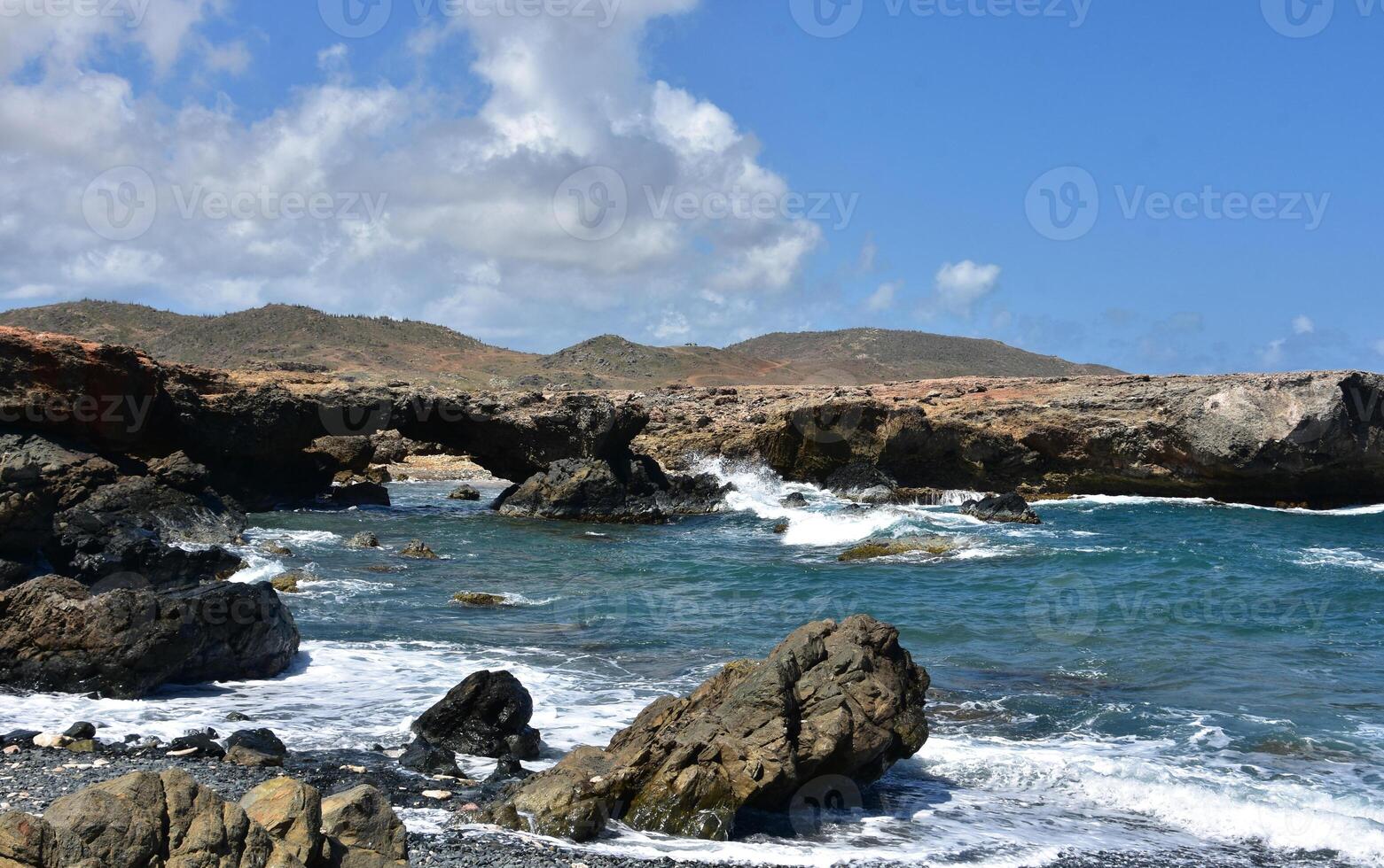 Natural Rock Bridge at Black Sand Beach photo
