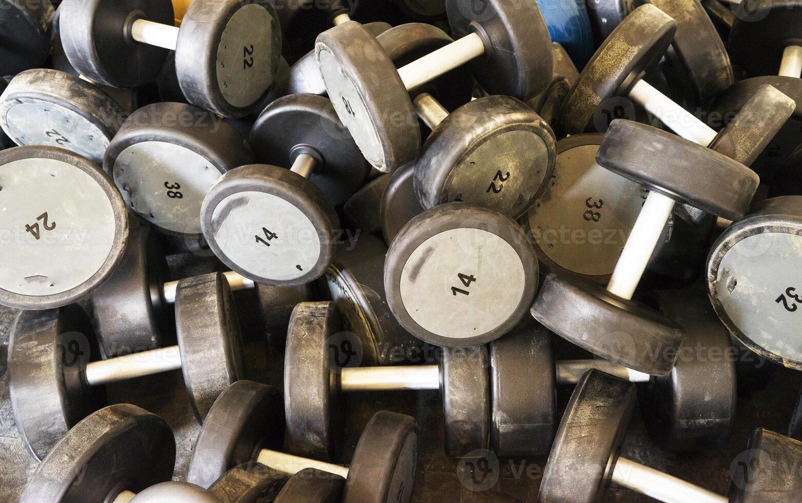 Dumbbells in modern sports club. photo