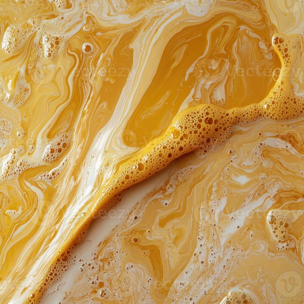 Abstract yellow and white liquid swirls with foam texture photo