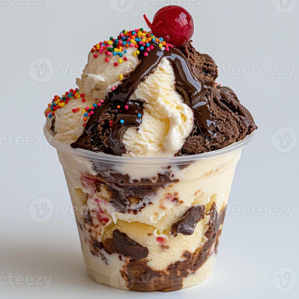 Close up of a delicious ice cream sundae with chocolate sauce, sprinkles, and a cherry on top photo
