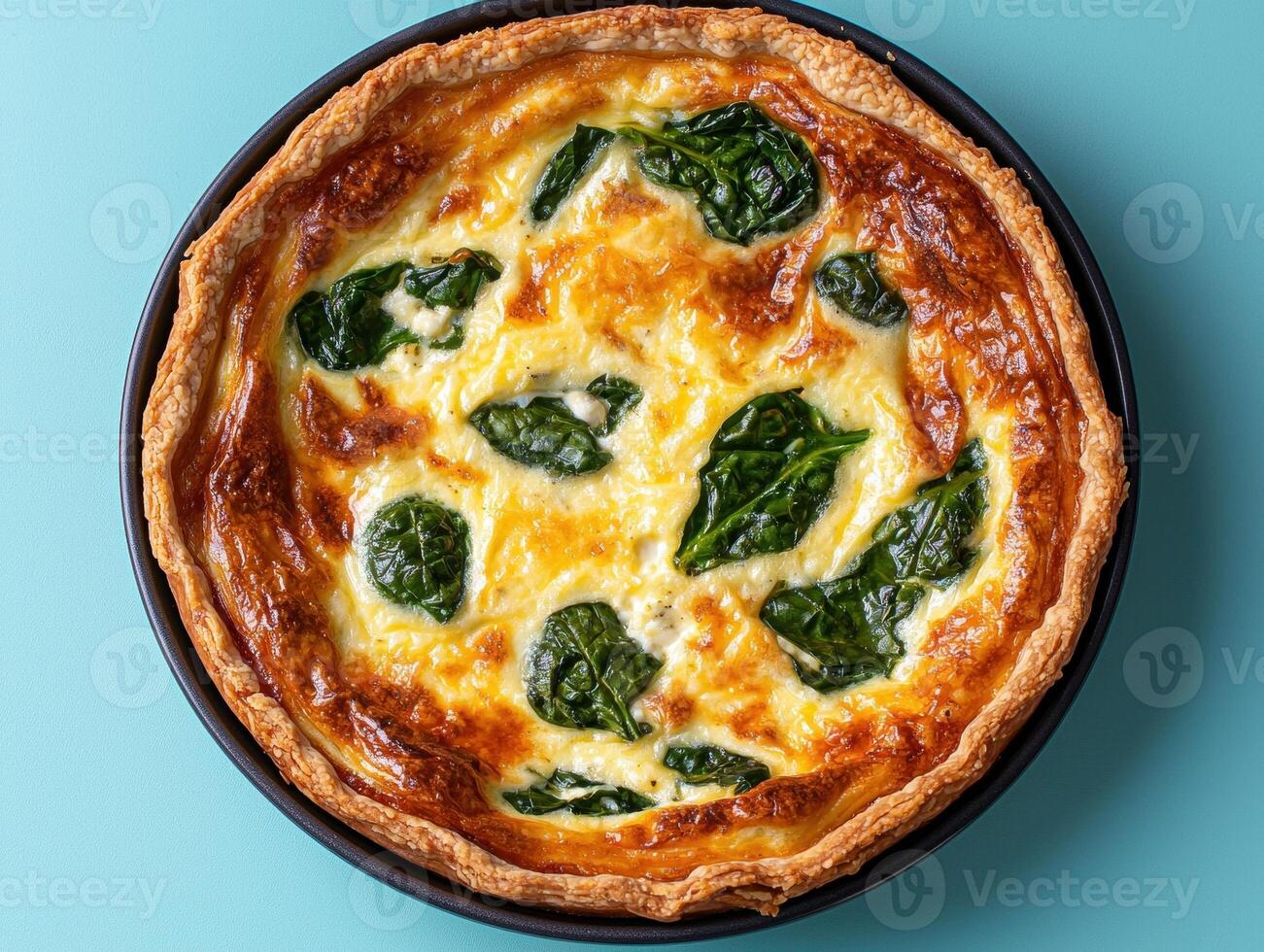 Delicious spinach and feta quiche in a rustic crust photo