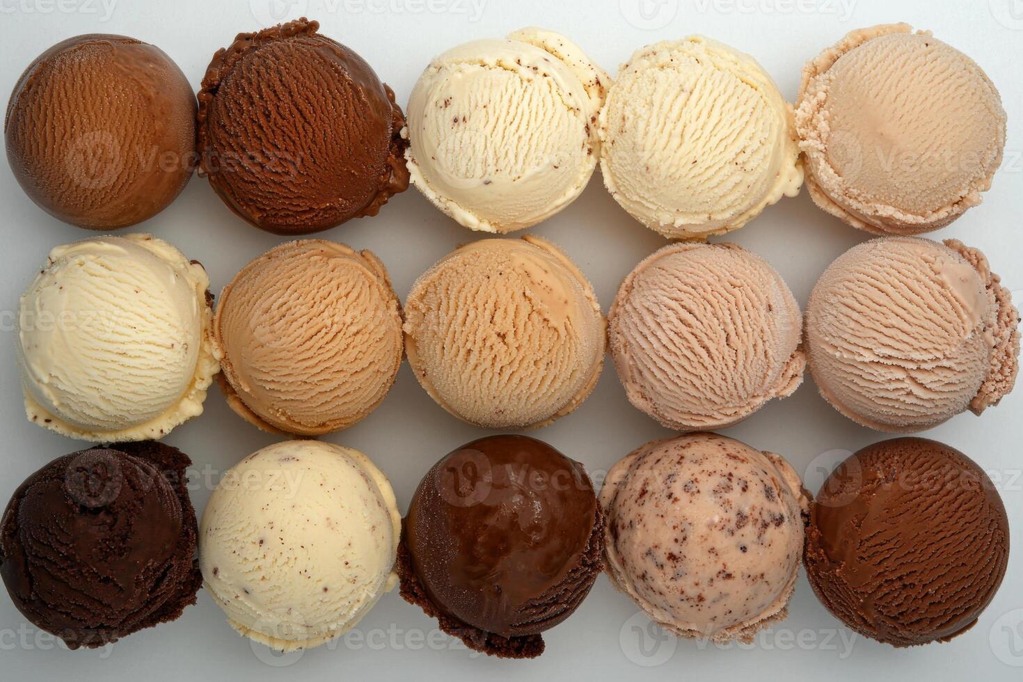 Twelve scoops of delicious ice cream in different flavors photo
