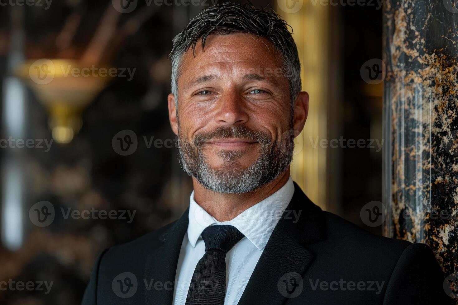 A smiling businessman in a suit photo