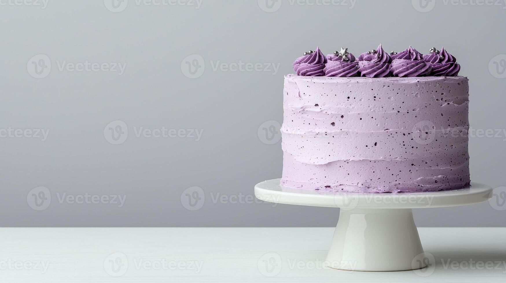 Delicious purple ombre cake on a white cake stand photo