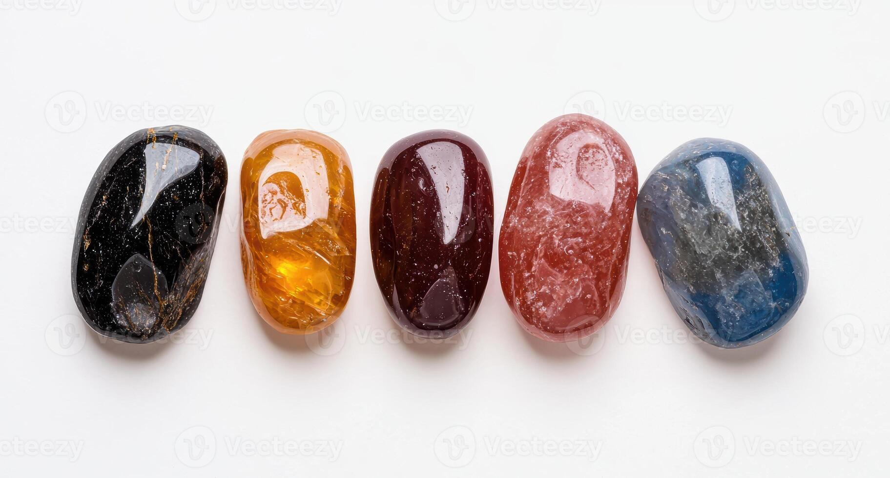 Five tumbled gemstones in a row on a white background photo