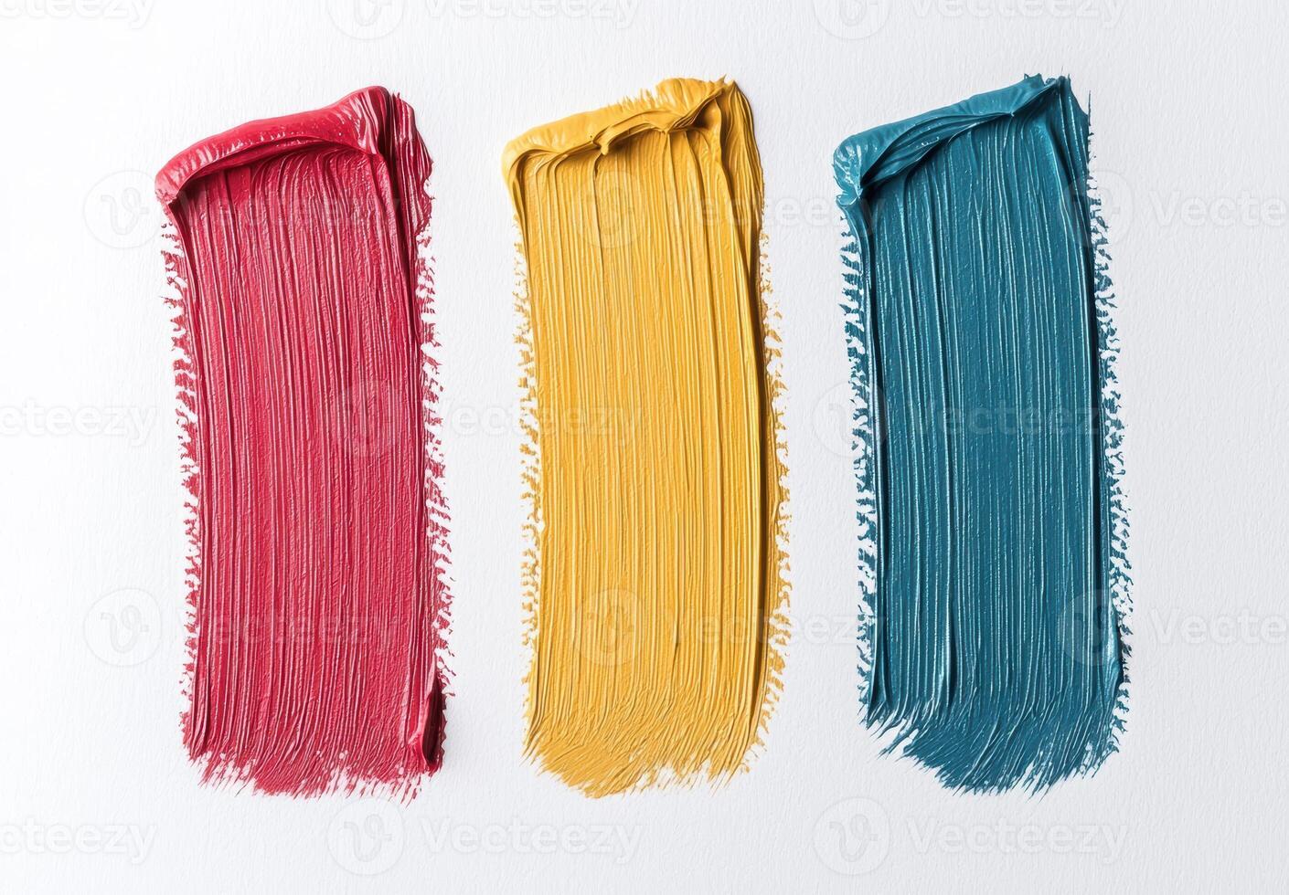 Close up of three vibrant paint strokes in red, yellow, and teal on a white background photo