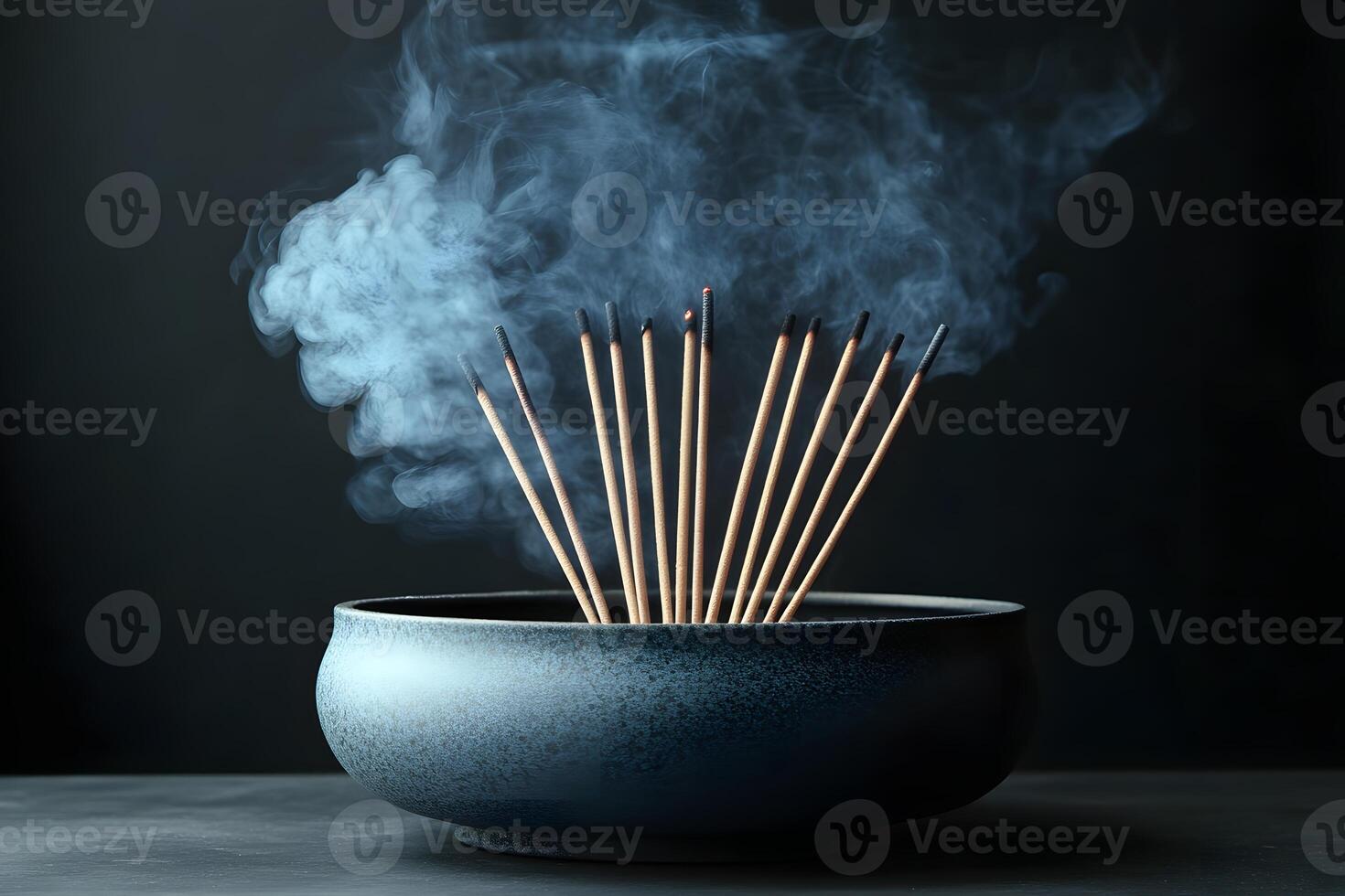 Aromatic Incense Sticks in Ceramic Bowl with Smoke Trail for Meditation and Relaxation photo