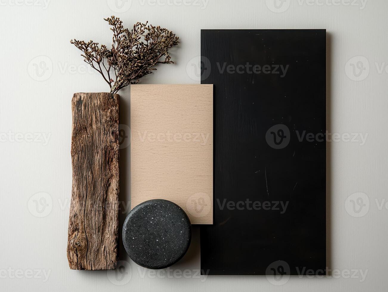 Flat lay of wooden textures, stone, and dried flowers on a neutral background photo