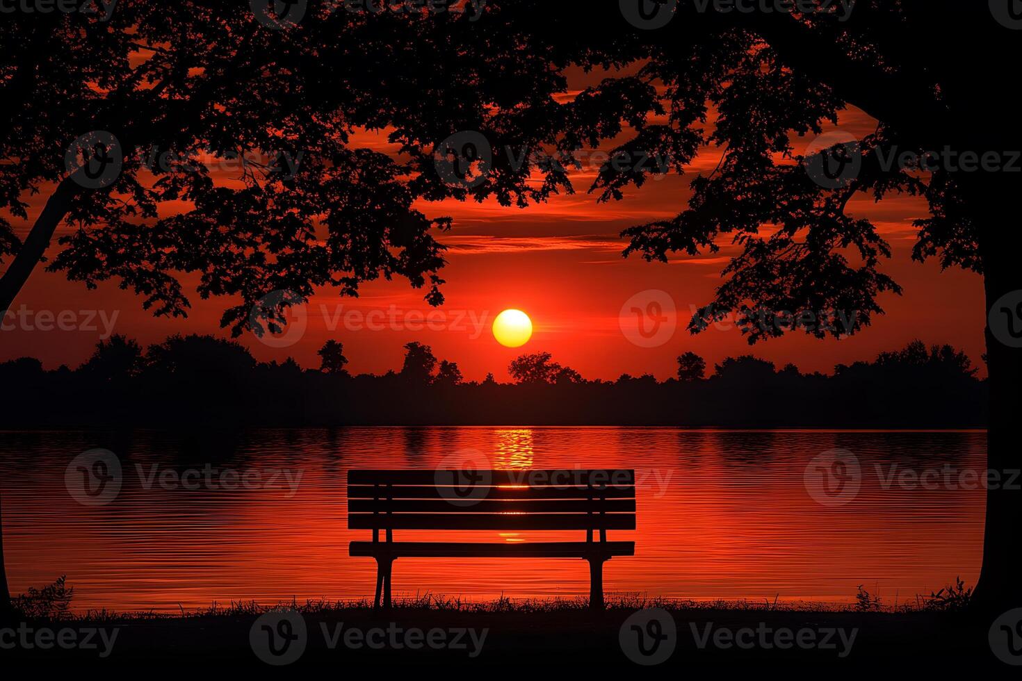 Serene Sunset Over Lake with Silhouette Bench and Tree Framing for Relaxation and Contemplation photo