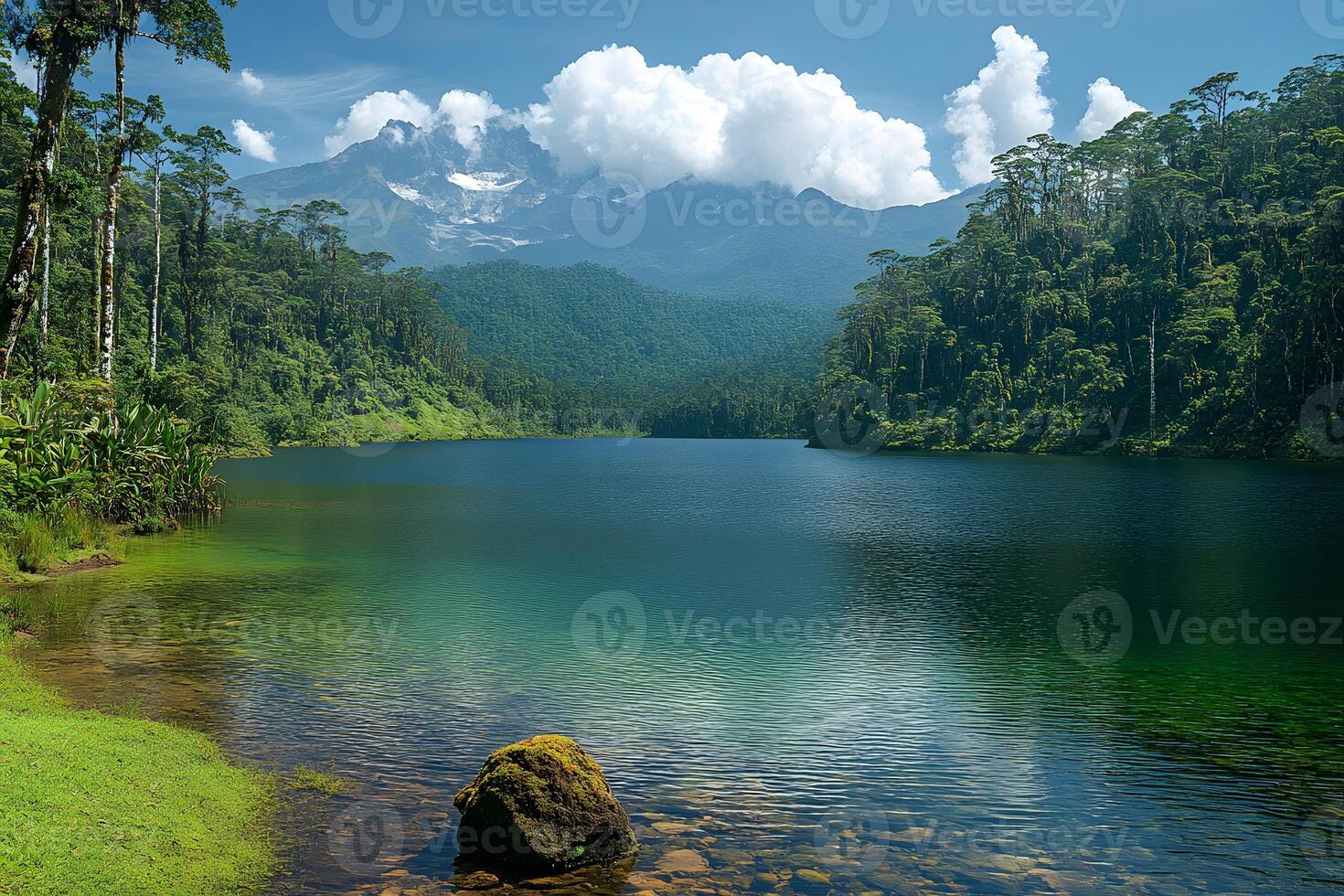 Serene Mountain Lake with Lush Forest and Majestic Clouds photo
