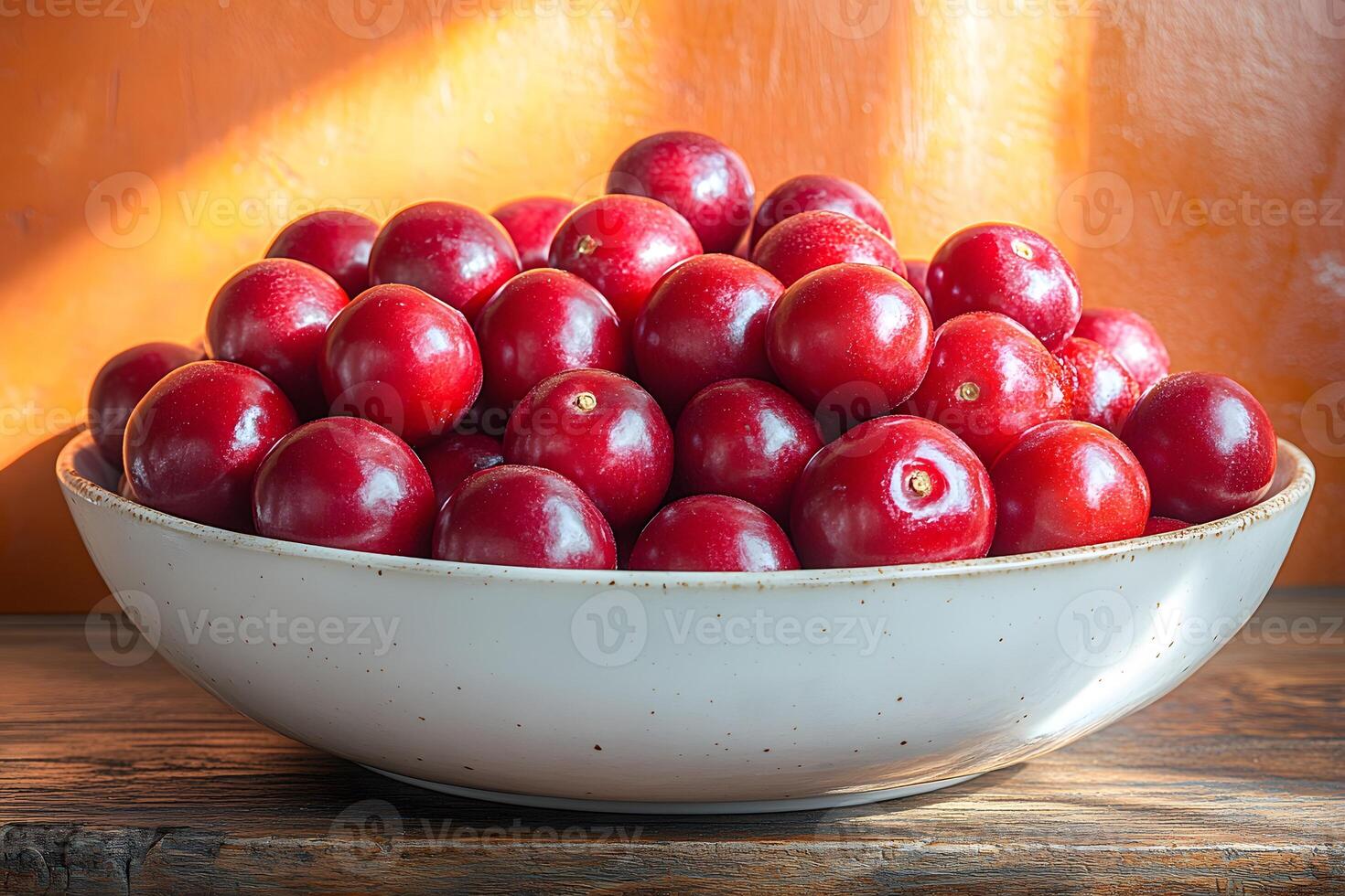 Bowl of Fresh Red Plums in Warm Sunlight - Harvest and Healthy Eating Concept for Kitchen Decor photo