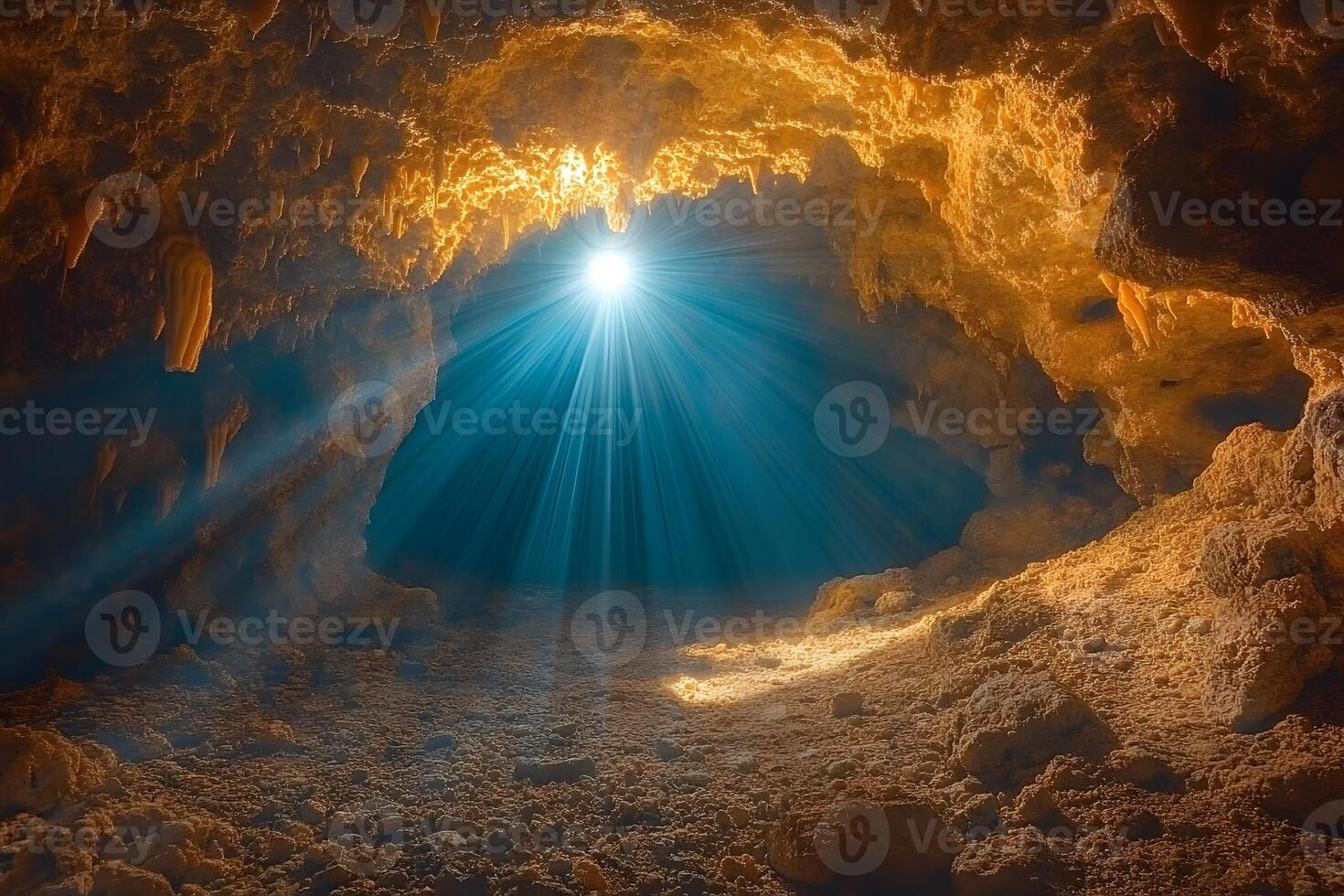 Sunlight Illuminating a Mysterious Cave Interior with Stalactites and Rocky Floor photo