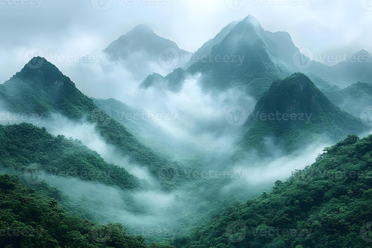 Breathtaking Mountain Landscape with Lush Greenery in Mystical Fog photo