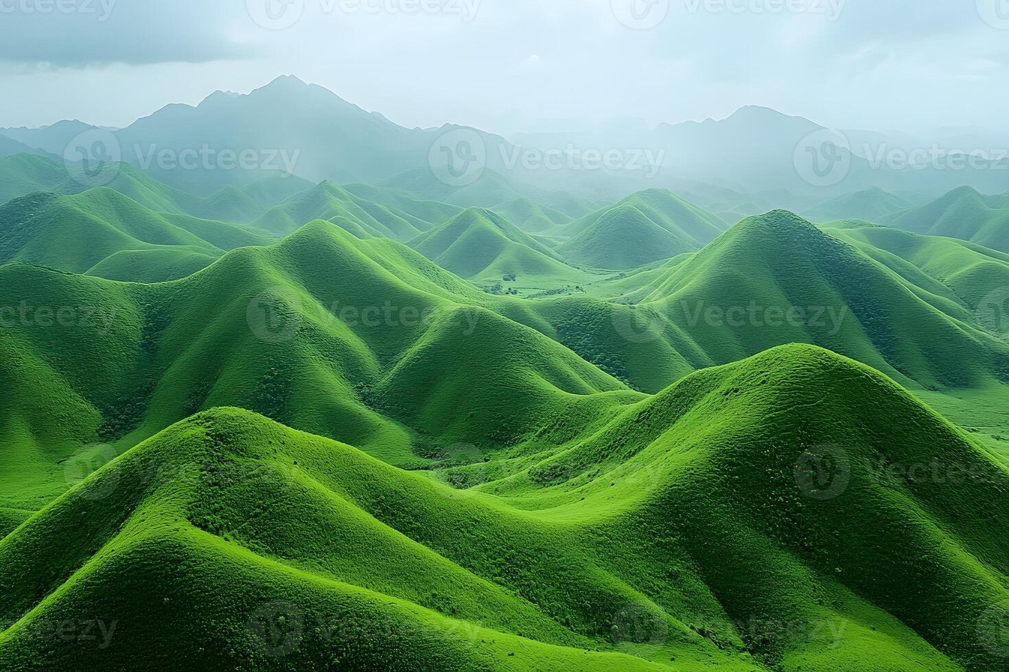 Lush Green Hills in Misty Landscape for Nature Poster or Card Design photo