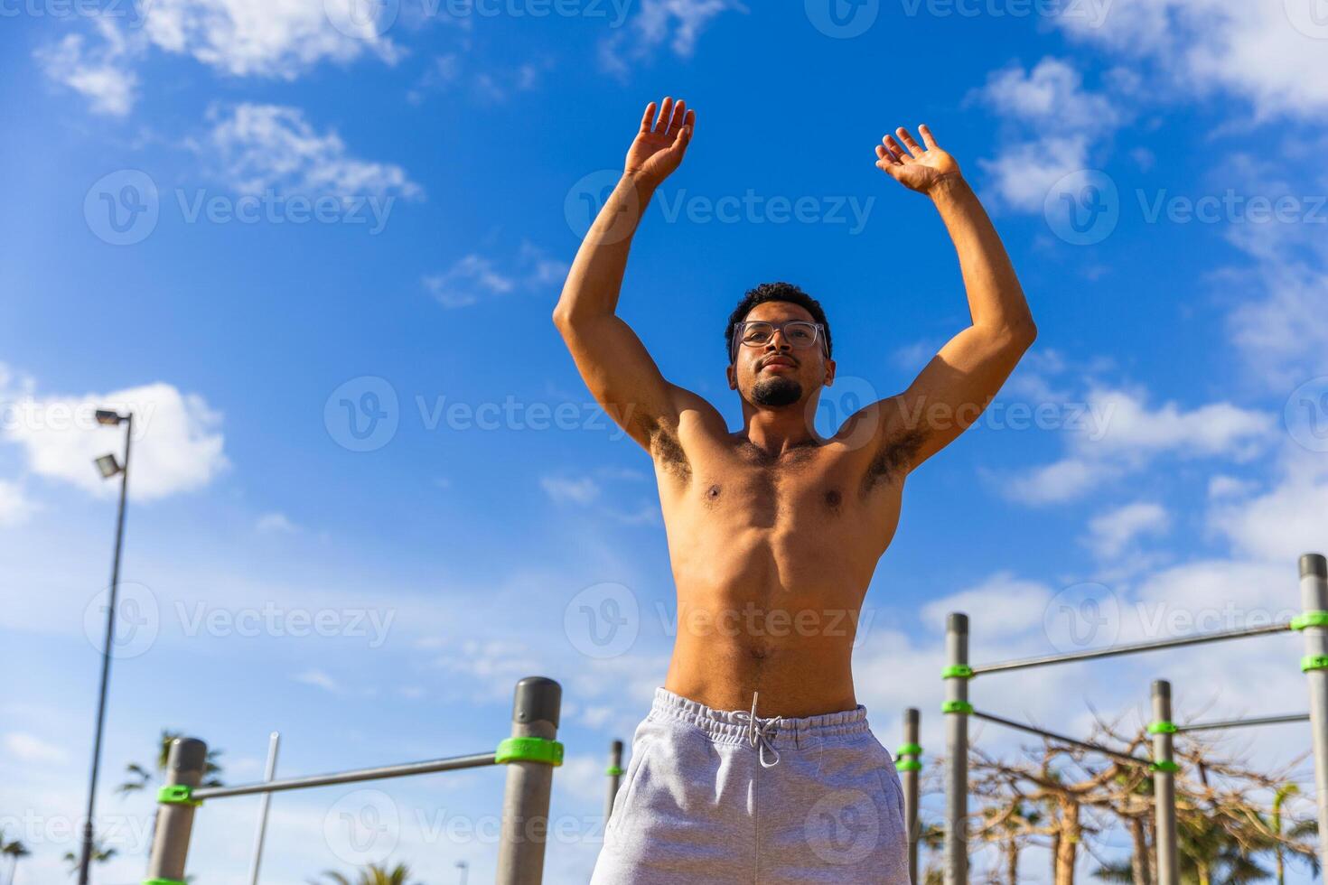 A man is warming up during his workout outroors photo