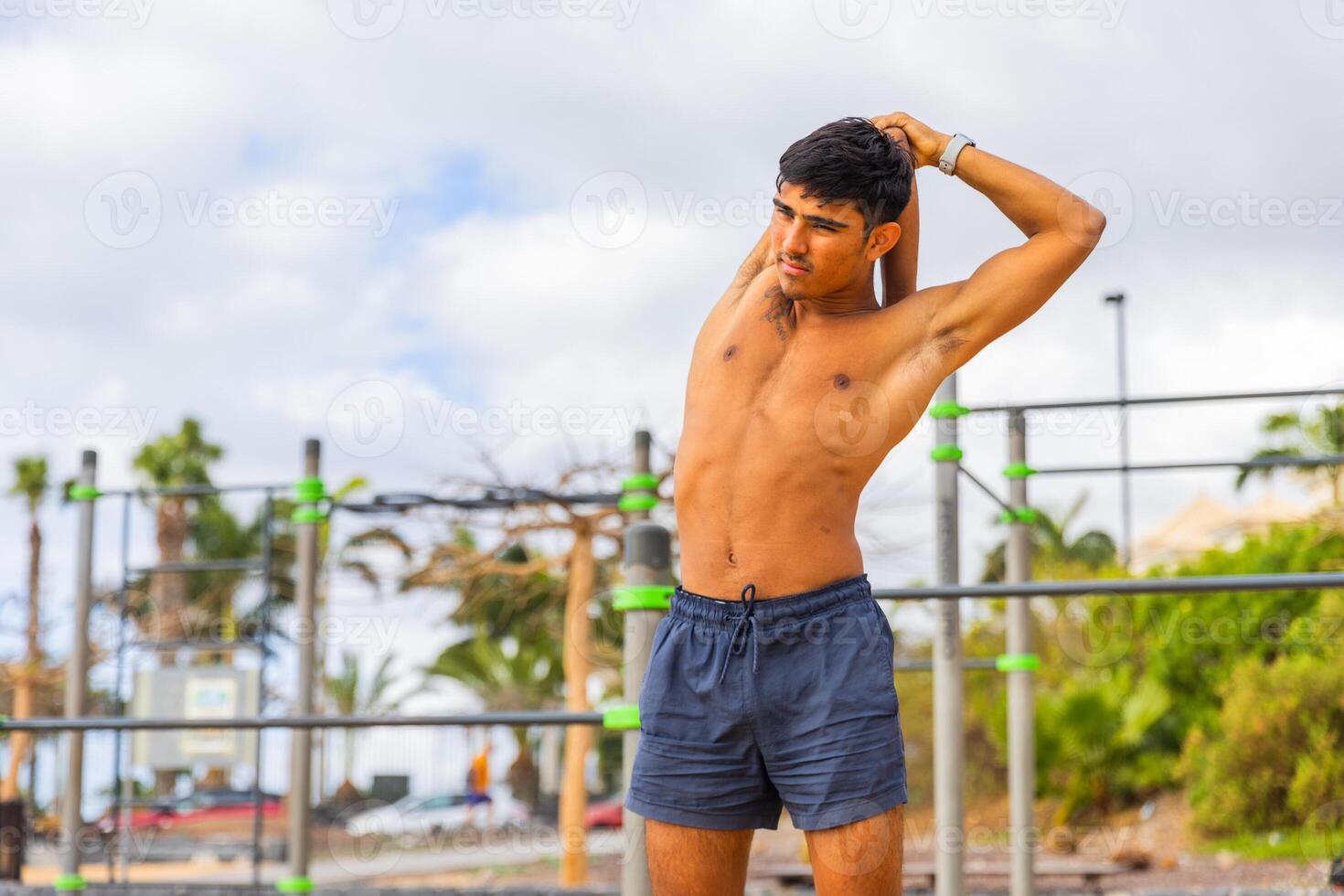 A man is doing a stretching exercise during his workout, healthy lifestyle photo