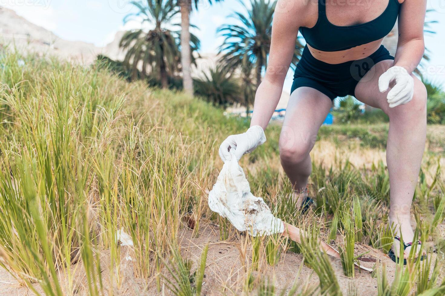 Close up of the trash picked up by a woman at the beach, photo with copy space
