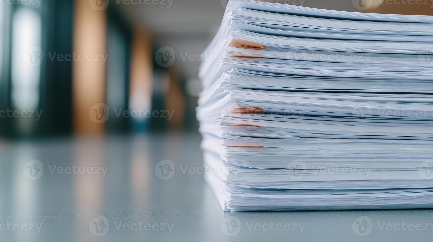 Stack of documents on table, showcasing organized paperwork with blurred background photo