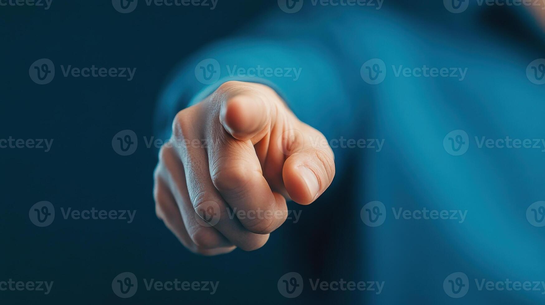 hand pointing forward, conveying sense of direction and authority. blue background adds professional touch photo