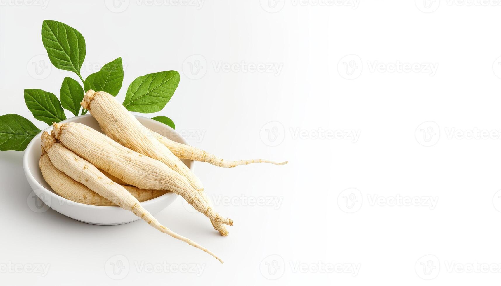 Fresh ginseng roots arranged in white ceramic bowl with green leaves, showcasing their natural beauty and health benefits photo