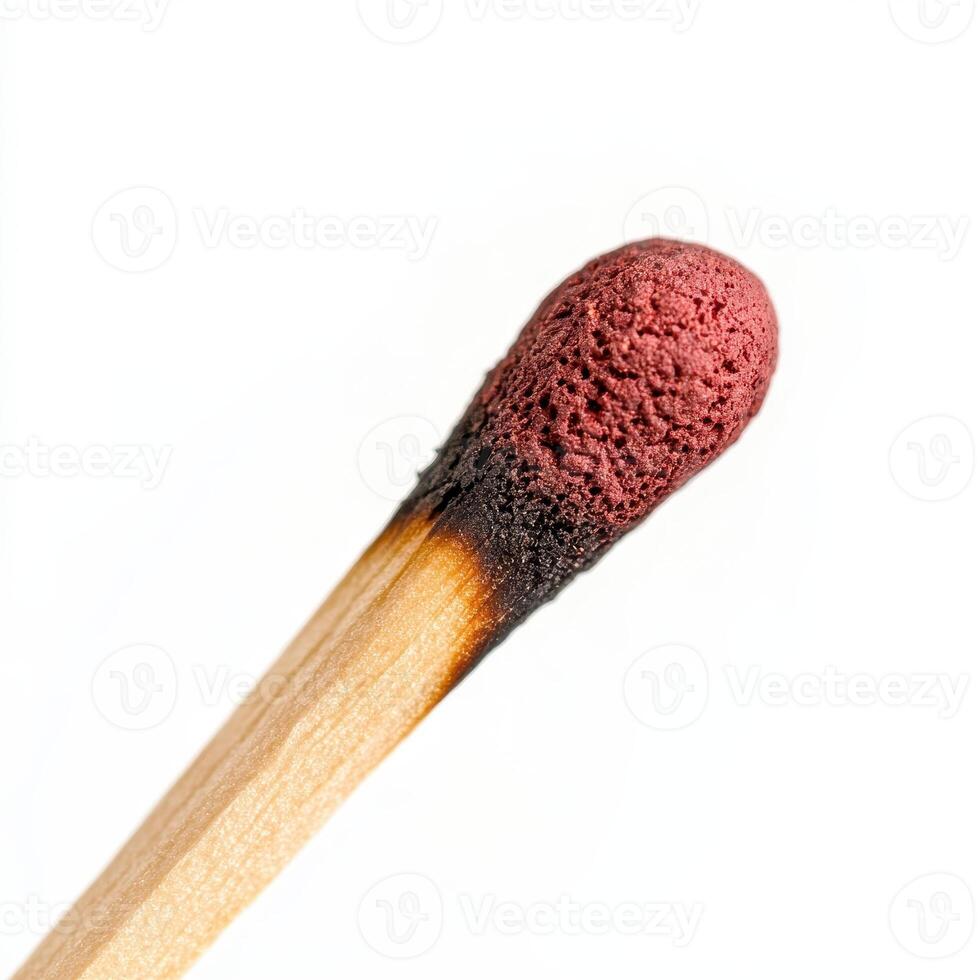 close up macro shot of matchstick head, showcasing its detailed texture and burnt tip photo